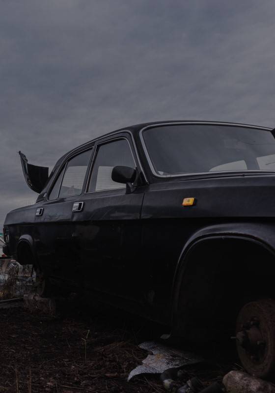 Old used car awaiting vehicle recycling